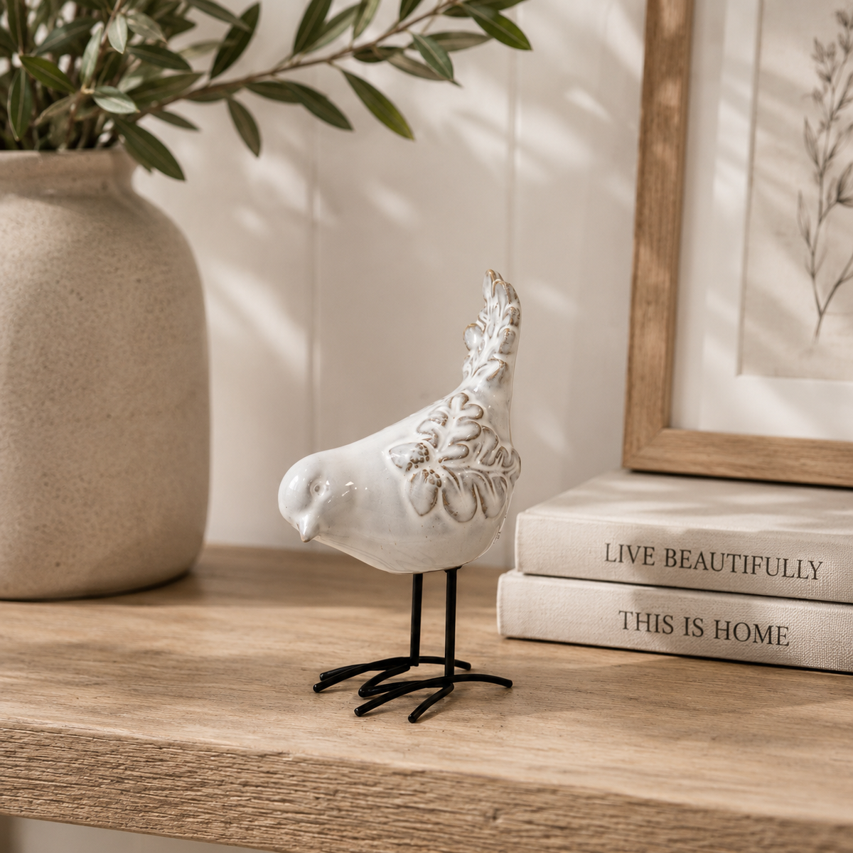 Glazed ceramic bird ornament with texture detail
