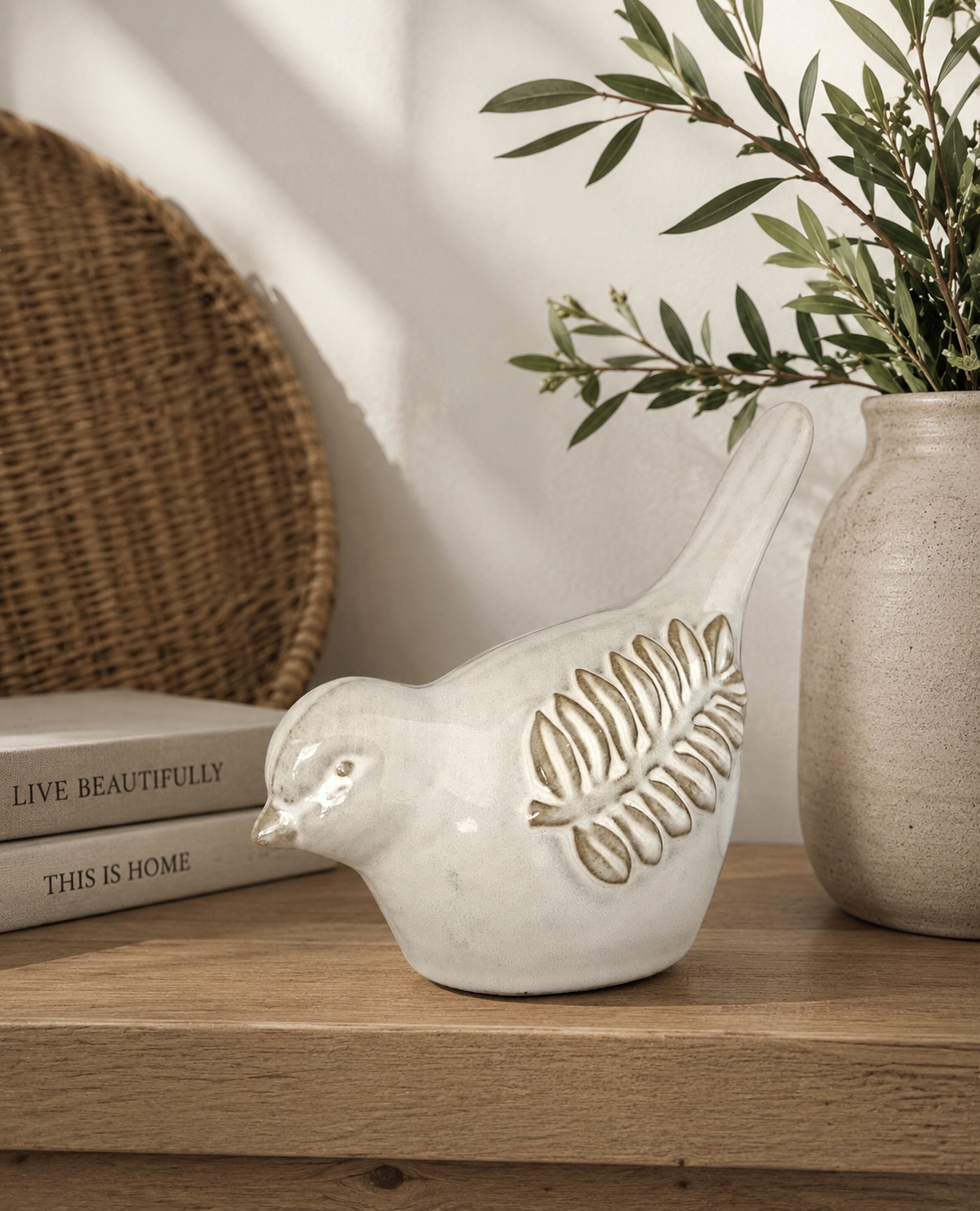 Natural ceramic bird ornament with olive branch detail