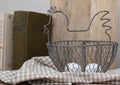 Rustic wire chicken egg basket for kitchen display
