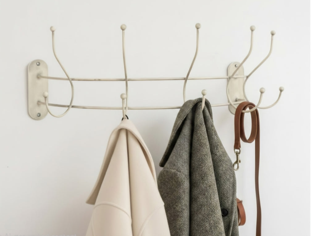 Ivory curved wall-mounted coat hanger rail