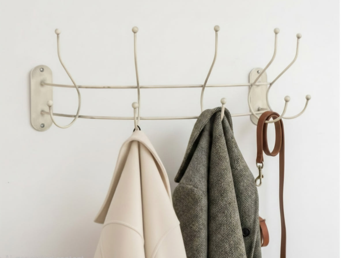 Ivory curved wall-mounted coat hanger rail