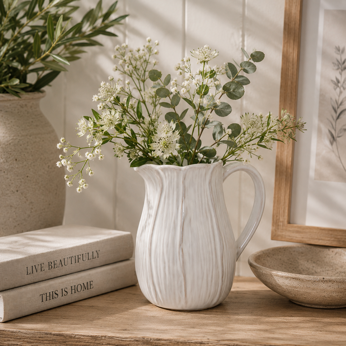 Natural ceramic jug with petal shape design detail