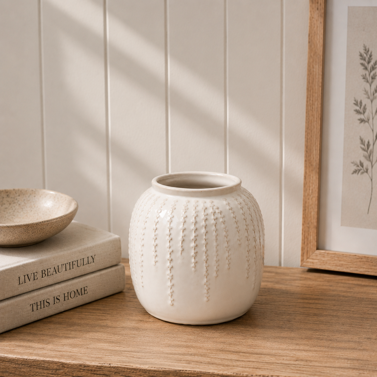 Small cream ceramic ribbed vase for home styling