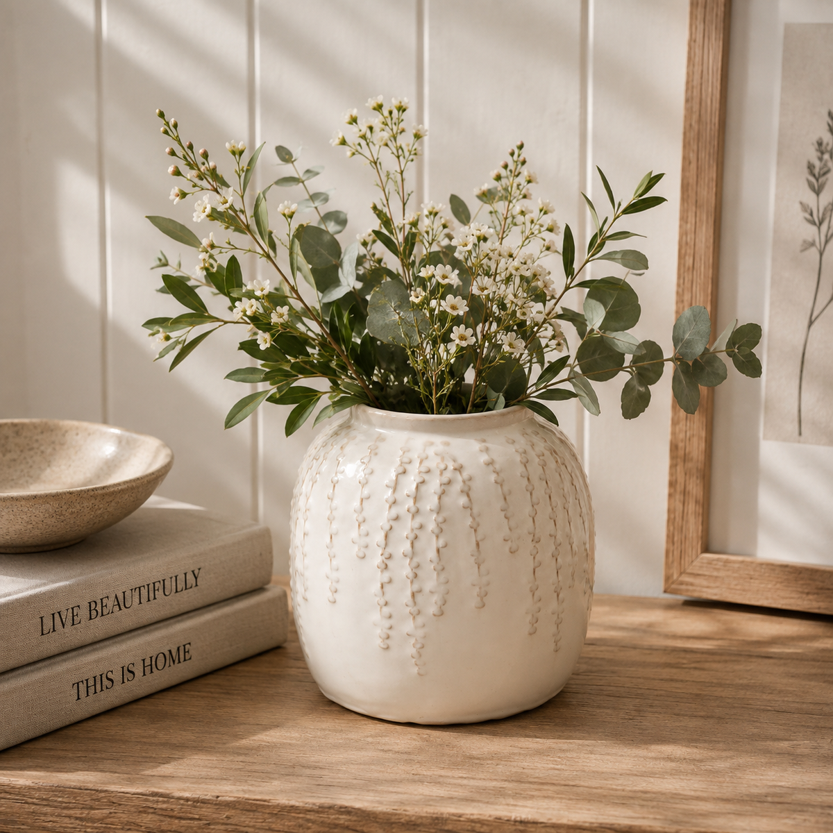 Small cream ceramic ribbed vase for home styling